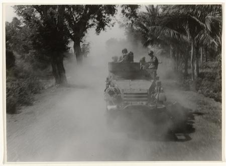 A reconnaissance division of the Marines drives an armored car during the advance to Probolinggo, June 21, 1947.